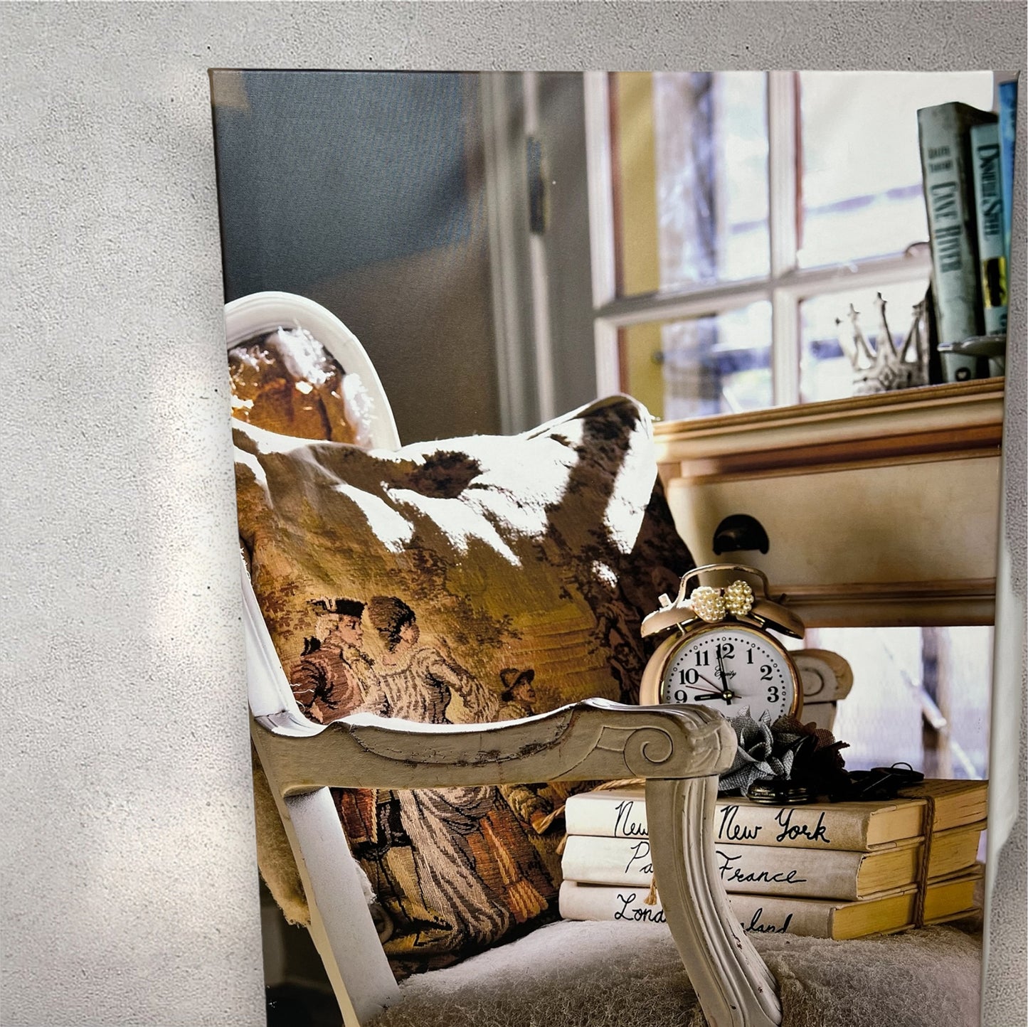 Antique chair, books, and clock in cottage home photography canvas print