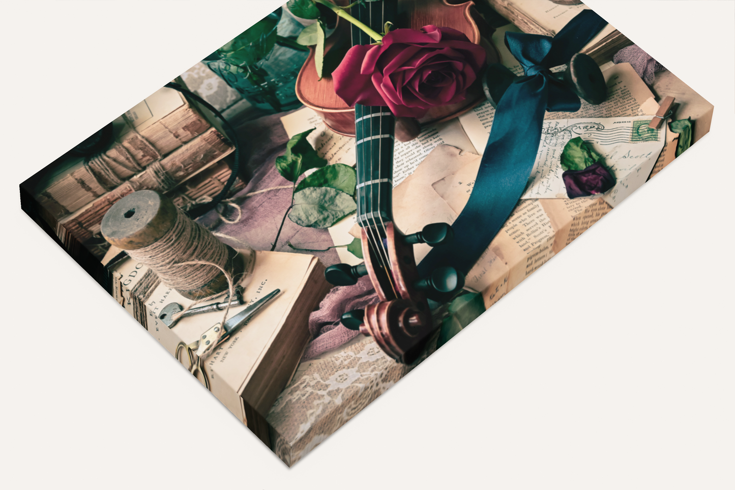 Gift card with vintage design featuring a rose, ribbon, and books on a white background