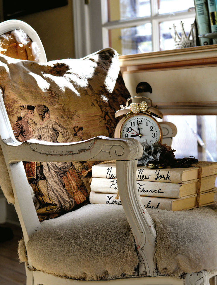 antique chair with clock and books
