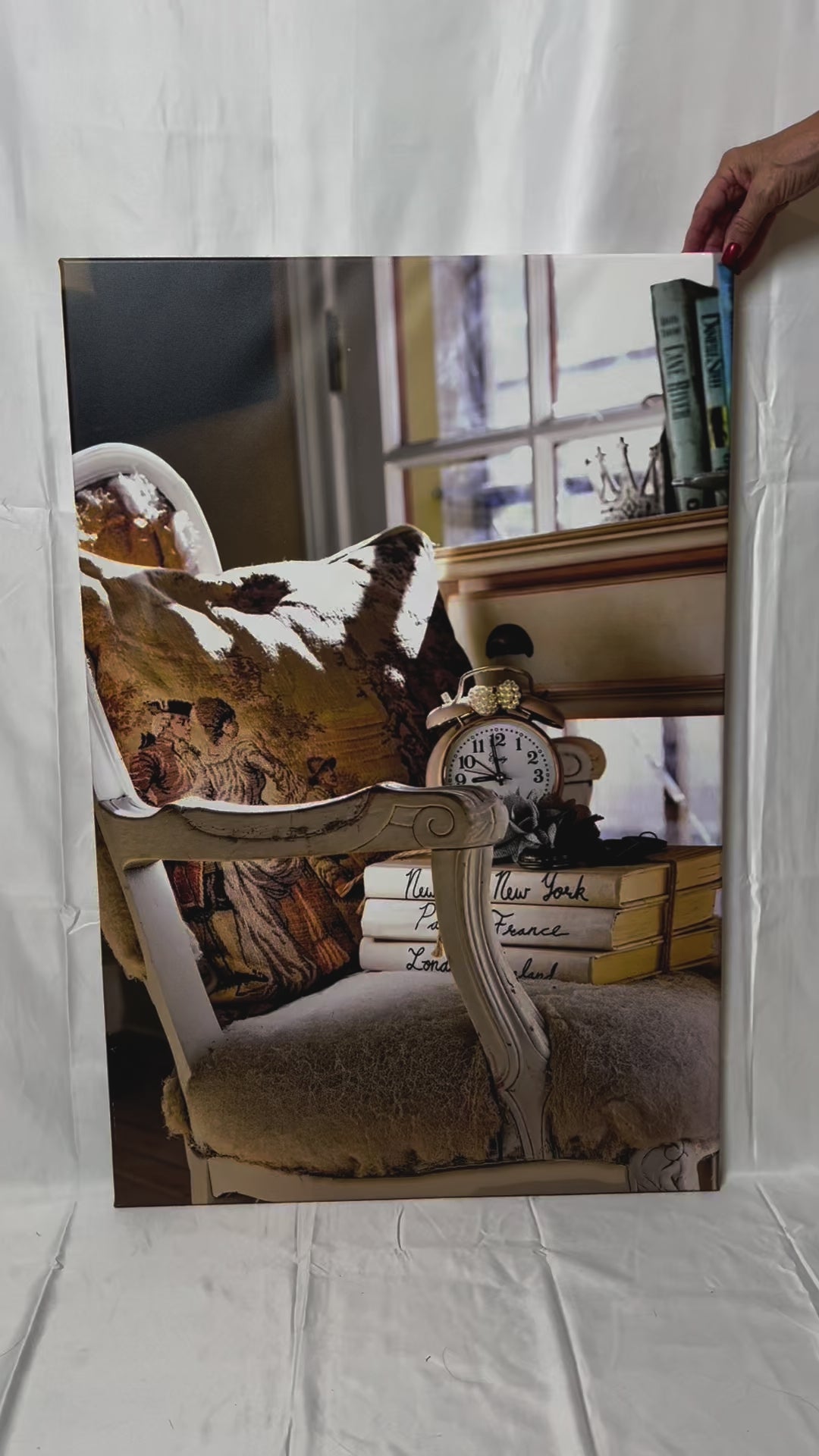 Antique chair, books, and clock in cottage home photography canvas print video preview